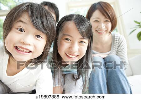 A family smiling View Large Photo Image Stock Photography - A family smiling. Fotosearch