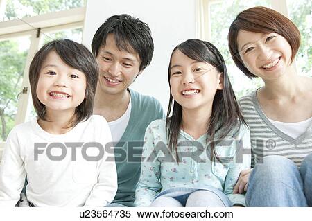 A family smiling View Large Photo Image Stock Photography - A family smiling. Fotosearch