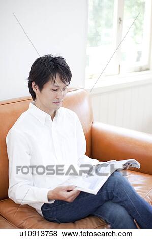 A man reading a magazine View Large Photo Image Stock Photo - A man reading a magazine. Fotosearch
