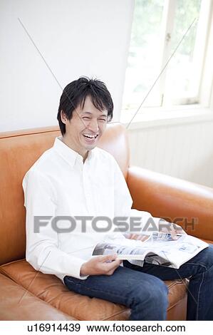 A man reading a magazine View Large Photo Image Stock Photo - A man reading a magazine. Fotosearch