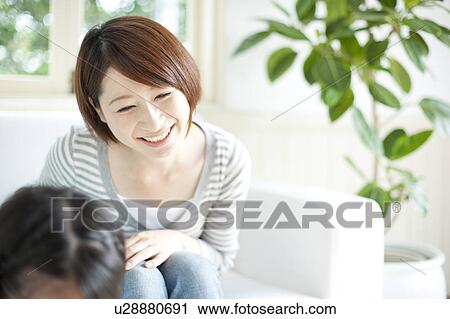 Stock Image - A smiling mother. Fotosearch