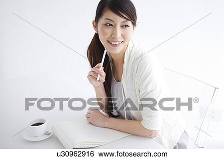 A woman writing letter View Large Photo Image Stock Photograph - A woman writing letter. Fotosearch