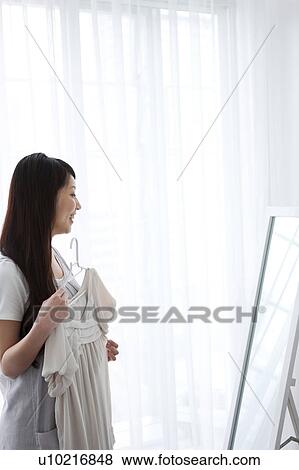 A young woman getting ready View Large Photo Image Stock Photo - A young woman getting ready. Fotosearch