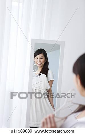 A young woman getting ready View Large Photo Image Stock Photo - A young woman getting ready. Fotosearch