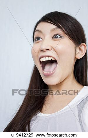 A young woman shouting View Large Photo Image Stock Photo - A young woman shouting. Fotosearch