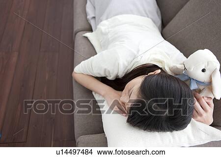 Picture - A young woman sleeping. Fotosearch