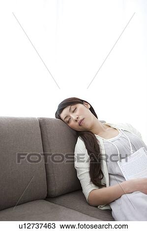 A young woman sleeping View Large Photo Image Stock Image - A young woman sleeping. Fotosearch