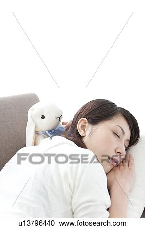 A young woman sleeping View Large Photo Image Stock Image - A young woman sleeping. Fotosearch
