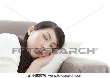 Stock Photograph - A young woman sleeping. Fotosearch