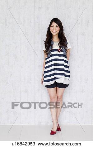 Stock Image - A young woman smiling. Fotosearch