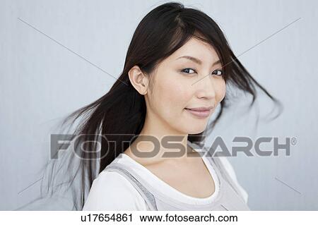 A young woman smiling View Large Photo Image Stock Image - A young woman smiling. Fotosearch