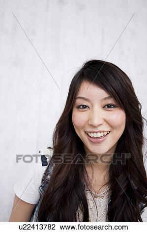 A young woman smiling View Large Photo Image Stock Image - A young woman smiling. Fotosearch