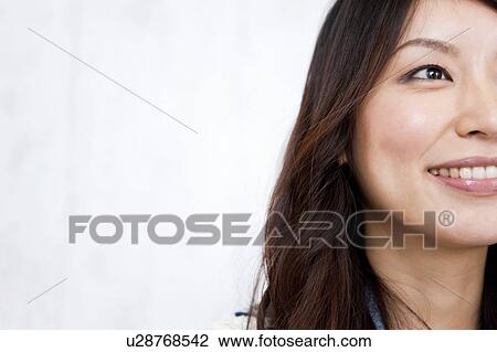 A young woman smiling View Large Photo Image Stock Image - A young woman smiling. Fotosearch