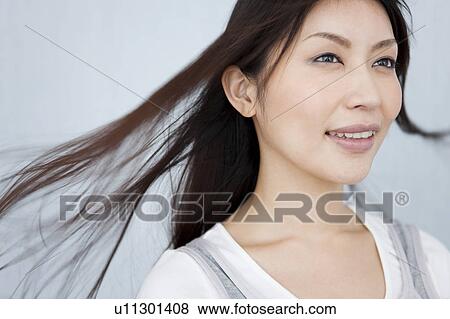 A young woman smiling View Large Photo Image Stock Photo - A young woman smiling. Fotosearch
