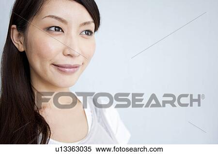 Stock Photography - A young woman smiling. Fotosearch
