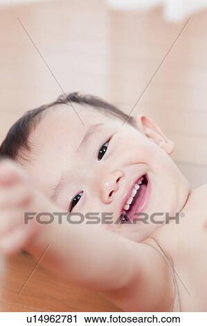 Stock Image - Baby Boy Lying on Back. Fotosearch