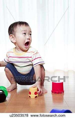 Baby Boy Playing With Toy Blocks View Large Photo Image Stock Photo - Baby Boy Playing With Toy Blocks. Fotosearch