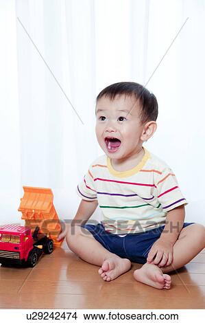Baby Boy Playing With Toy Car View Large Photo Image Picture - Baby Boy Playing With Toy Car. Fotosearch