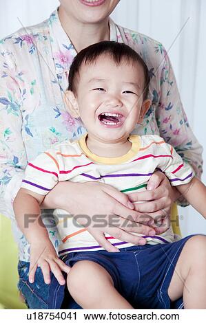 Baby Boy Sitting on Mother's Lap View Large Photo Image Stock Image - Baby Boy Sitting on Mother's Lap. Fotosearch