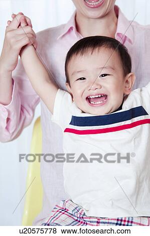 Baby Boy Sitting on Mother's Lap View Large Photo Image Stock Photo - Baby Boy Sitting on Mother's Lap. Fotosearch