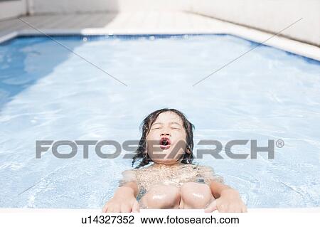 Stock Image - Boy in a swimming pool, Hyogo Prefecture, Honshu, Japan. Fotosearch