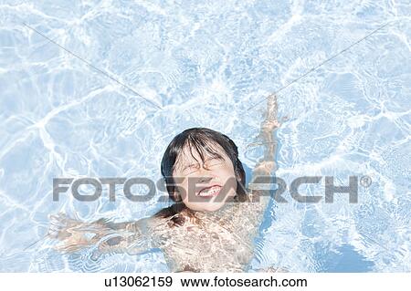 Stock Photo - Boy in a swimming pool, Hyogo Prefecture, Honshu, Japan. Fotosearch