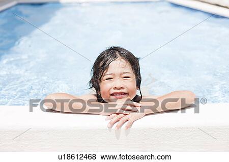 Stock Photo - Boy in a swimming pool, Hyogo Prefecture, Honshu, Japan. Fotosearch