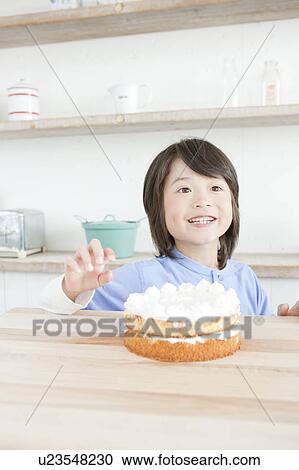 Boy in front of a cake, Hyogo Prefecture, Honshu, Japan View Large Photo Image Stock Image - Boy in front of a cake, Hyogo Prefecture, Honshu, Japan. Fotosearch