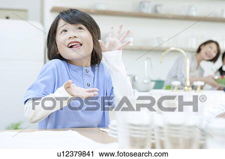 Stock Image - Boy making a face, Hyogo Prefecture, Honshu, Japan. Fotosearch