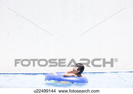 Boy with inflatable, Hyogo Prefecture, Honshu, Japan View Large Photo Image Picture - Boy with inflatable, Hyogo Prefecture, Honshu, Japan. Fotosearch