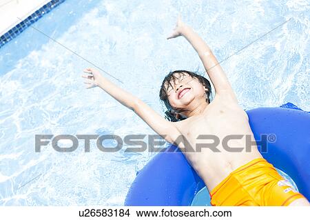 Picture - Boy with inflatable, Hyogo Prefecture, Honshu, Japan. Fotosearch