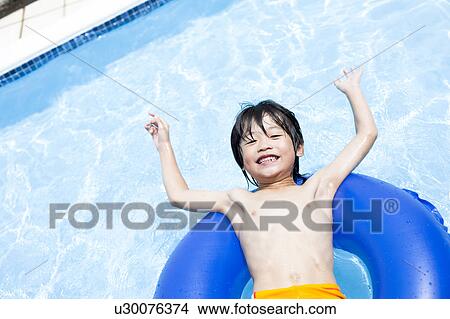 Boy with inflatable, Hyogo Prefecture, Honshu, Japan View Large Photo Image Picture - Boy with inflatable, Hyogo Prefecture, Honshu, Japan. Fotosearch