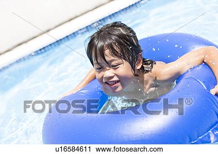 Boy with inflatable, Hyogo Prefecture, Honshu, Japan View Large Photo Image Stock Image - Boy with inflatable, Hyogo Prefecture, Honshu, Japan. Fotosearch