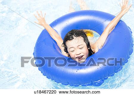 Boy with inflatable, Hyogo Prefecture, Honshu, Japan View Large Photo Image Stock Image - Boy with inflatable, Hyogo Prefecture, Honshu, Japan. Fotosearch