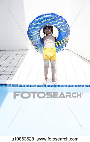 Stock Photo - Boy with inflatable, Hyogo Prefecture, Honshu, Japan. Fotosearch
