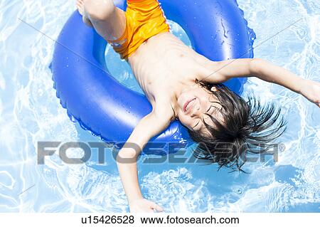 Boy with inflatable, Hyogo Prefecture, Honshu, Japan View Large Photo Image Stock Photo - Boy with inflatable, Hyogo Prefecture, Honshu, Japan. Fotosearch