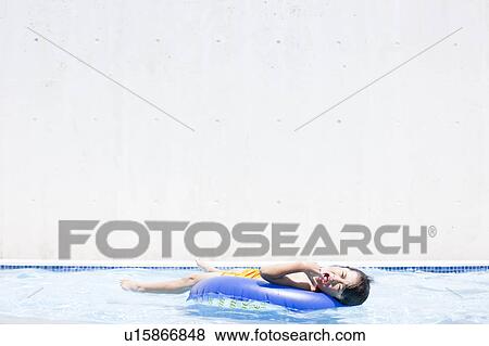 Stock Photo - Boy with inflatable, Hyogo Prefecture, Honshu, Japan. Fotosearch