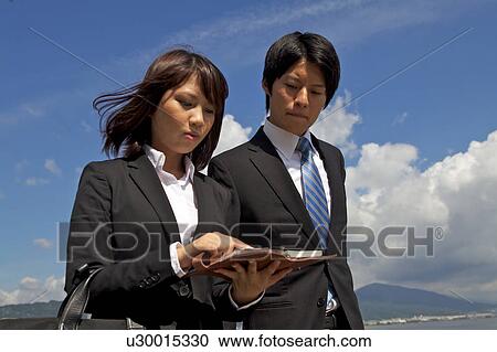 Business people walking outdoors, Shiga Prefecture, Honshu, Japan View Large Photo Image Stock Image - Business people walking outdoors, Shiga Prefecture, Honshu, Japan. Fotosearch