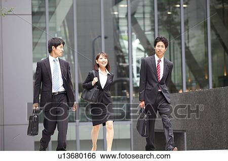 Business people walking outdoors View Large Photo Image Stock Photograph - Business people walking outdoors. Fotosearch