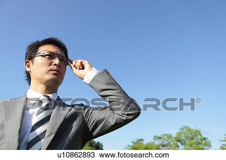 Businessman Against Blue Sky View Large Photo Image Stock Image - Businessman Against Blue Sky. Fotosearch