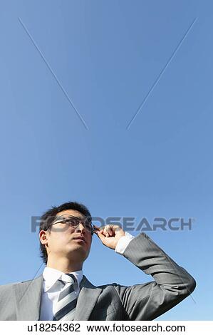 Businessman Against Blue Sky View Large Photo Image Stock Image - Businessman Against Blue Sky. Fotosearch