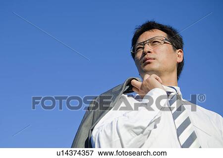 Businessman Against Blue Sky View Large Photo Image Stock Photo - Businessman Against Blue Sky. Fotosearch