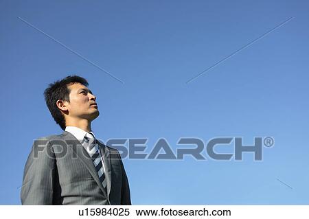 Stock Photography - Businessman Looking Up. Fotosearch