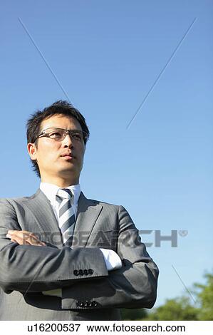 Stock Photo - Businessman, Low Angle View. Fotosearch