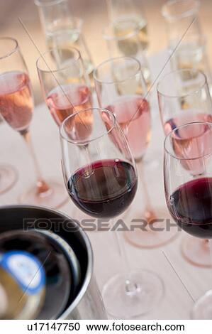 Stock Image - Champagne and red wine in champagne glasses, Nagoya city, Aichi Prefecture, Japan. Fotosearch