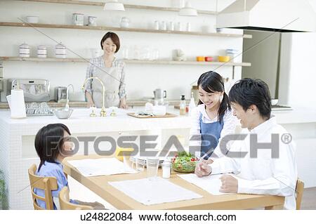 Picture - Family eating breakfast, Hyogo Prefecture, Honshu, Japan. Fotosearch