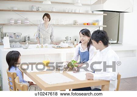 Stock Photo - Family eating breakfast, Hyogo Prefecture, Honshu, Japan. Fotosearch