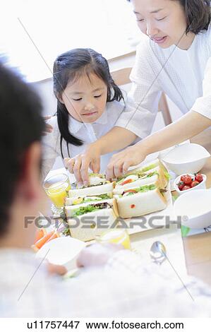 Family Having Sandwiches View Large Photo Image Stock Photo - Family Having Sandwiches. Fotosearch