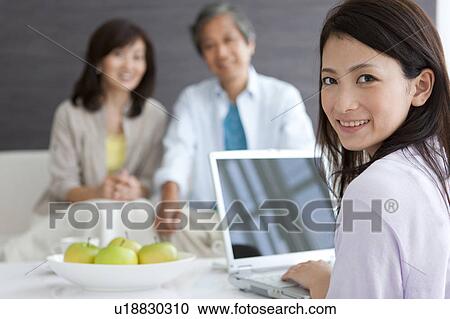Family in living room View Large Photo Image Stock Image - Family in living room. Fotosearch