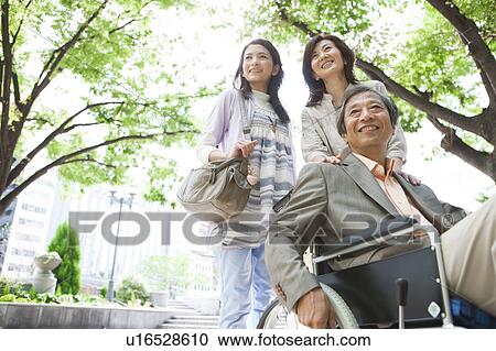 Family standing on sidewalk View Large Photo Image Stock Image - Family standing on sidewalk. Fotosearch